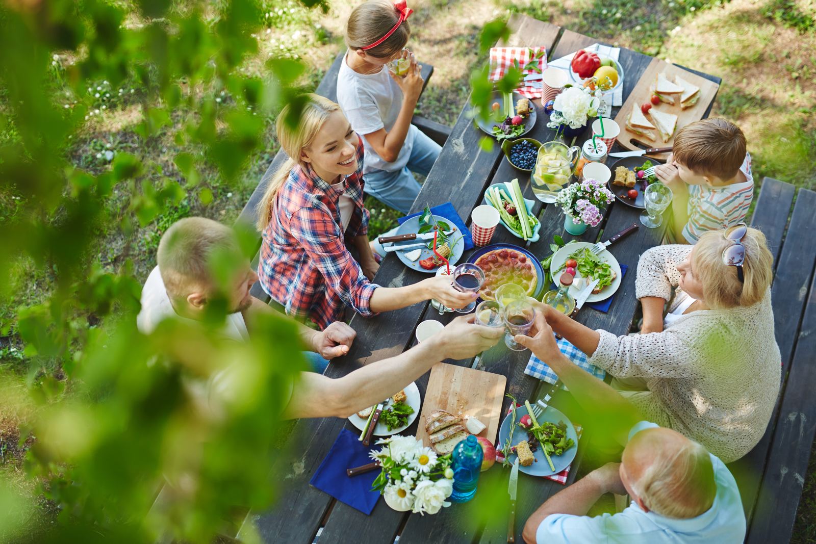 A family and friends gathered at an outdoor table