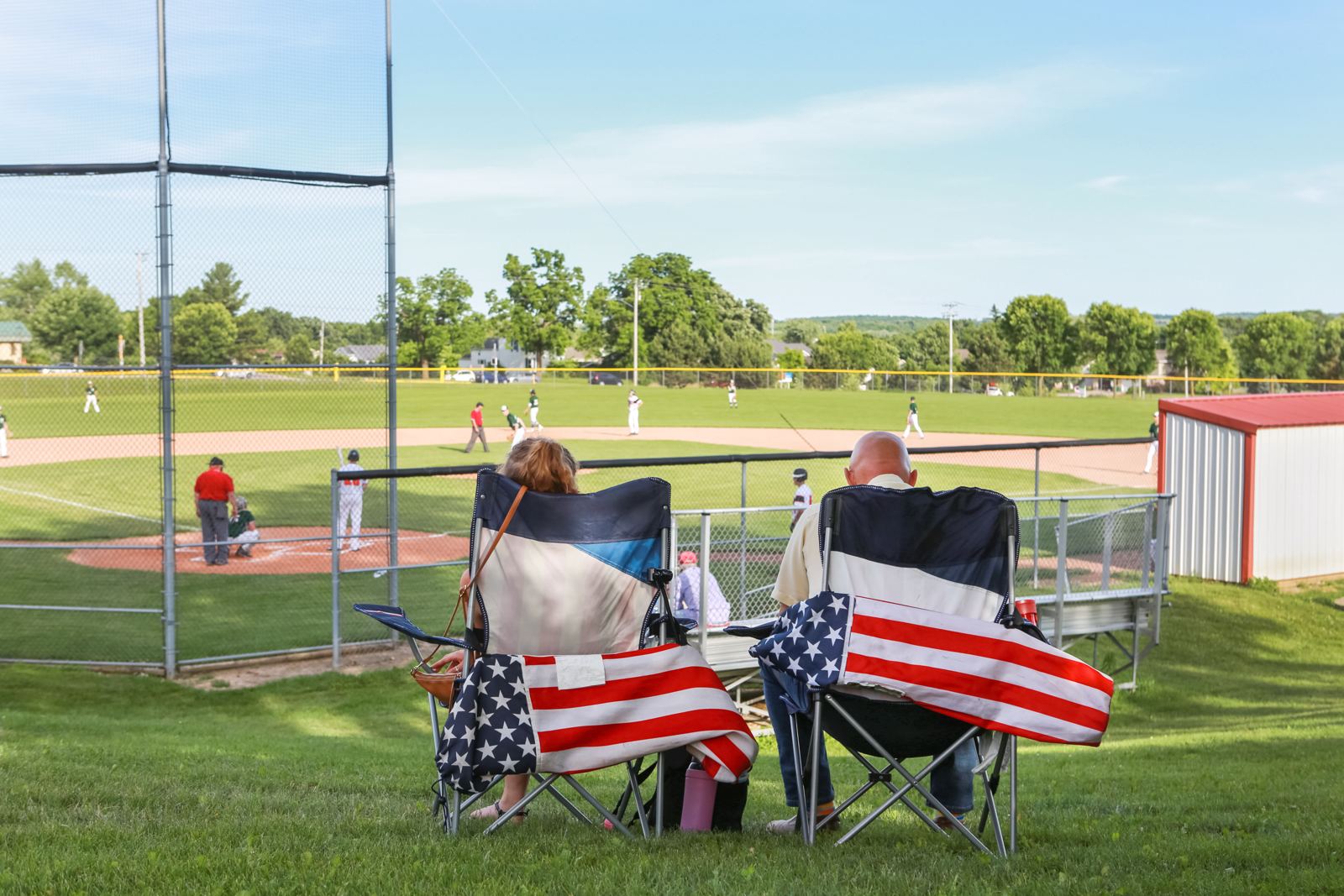 Grandparents watching a youth baseball game