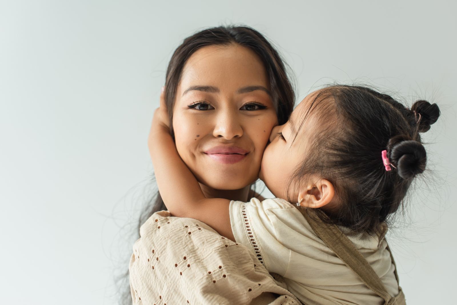A parent reviewing finances at home with a young child